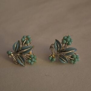 Elegant Silver and Turquoise Butterfly Earrings, with Intricate Detailing.